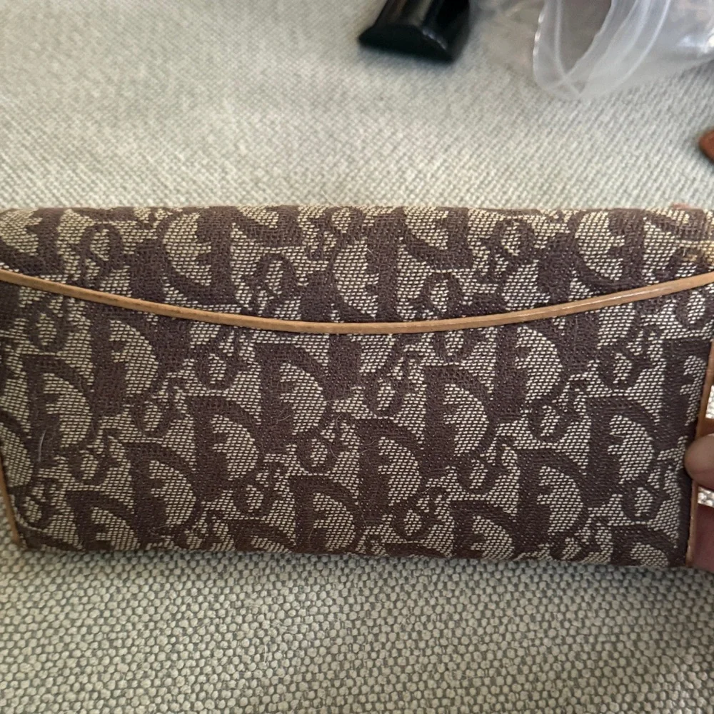 Dior Tan and Brown Monogram Wallet with snap clip close pouch.
